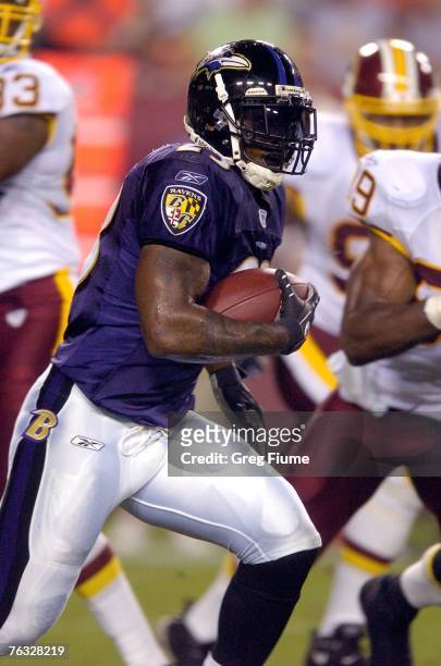 Willis McGahee of the Baltimore Ravens rushes the ball against the Washington Redskins in a preseason NFL game August 25, 2007 at FedEx Field in...