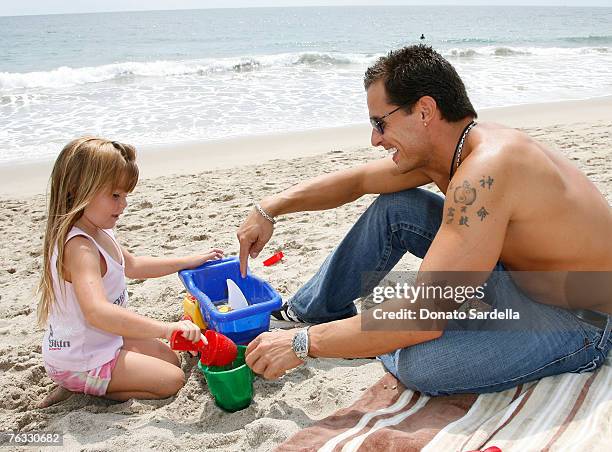Actor Antonio Sabato with daughter Mina Sabato play on the beach at the French Connection's "Kids connection to benefit The Art Of Elysium" on August...