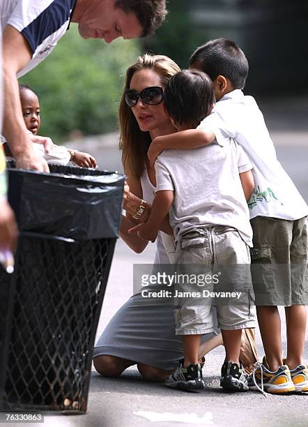 Zahara Jolie-Pitt, Maddox Jolie-Pitt, Angelina Jolie and Pax Jolie-Pitt visit the Central Park Carousel in New York City on August 25, 2007.