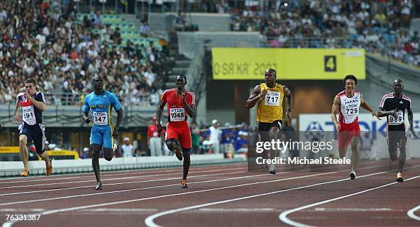 Craig Pickering of Great Britain, Derrick Atkins of the Bahamas, Marc Burns of Trinidad and Tobago, Asafa Powell of Jamaica, Nobuharu Asahara of...