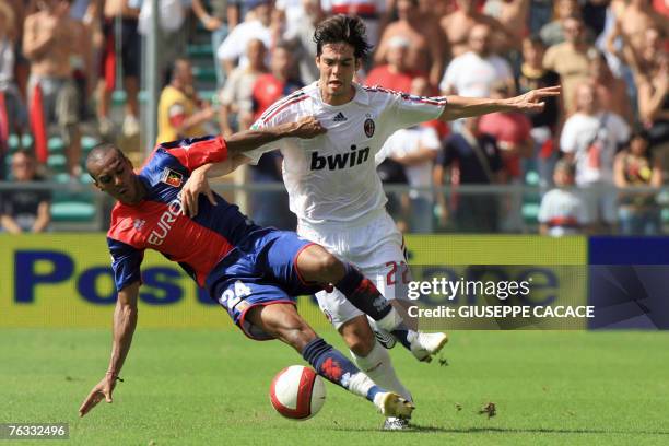 Milan's forward Kak? of Brazil challenge sfor the ball with Genoa 's defender Abdoulay Konko of France during their Serie A match at "Luigi Ferraris"...