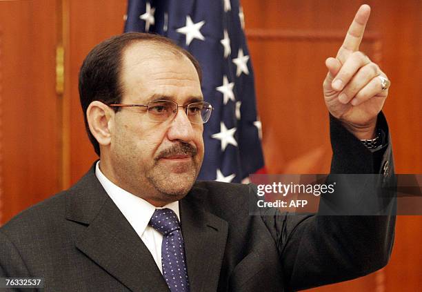 Iraqi Prime Minister Nuri al-Maliki gestures as he announces the news that Abu Musab al-Zarqawi, al-Qaeda's leader in Iraq who led a bloody campaign...