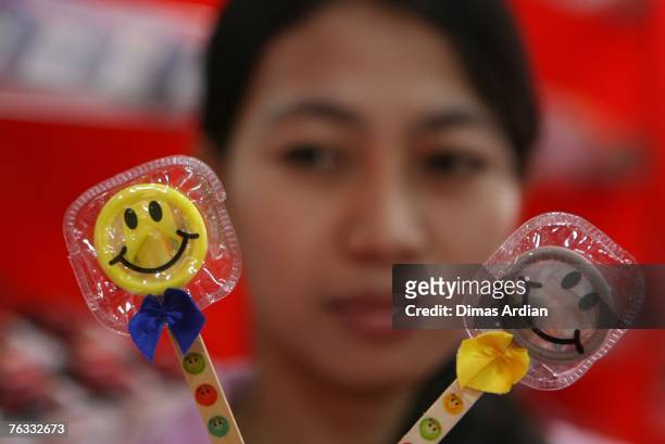 The Guard" shop-keeper shows condoms sold in her shop at the Discovery Shopping Mall on Sunday, August 26, 2007 in Kuta, Bali Resort Island,...