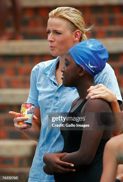 Swimmer Charlene Wittstock coaches children during a training session on December 2, 2006 in Richards Bay, South Africa.