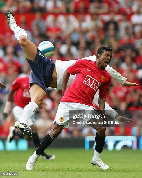 Ricardo Rocha of Tottenham Hotspur collides with Nani of Manchester United during the Barclays Premier League match between Manchester United and...