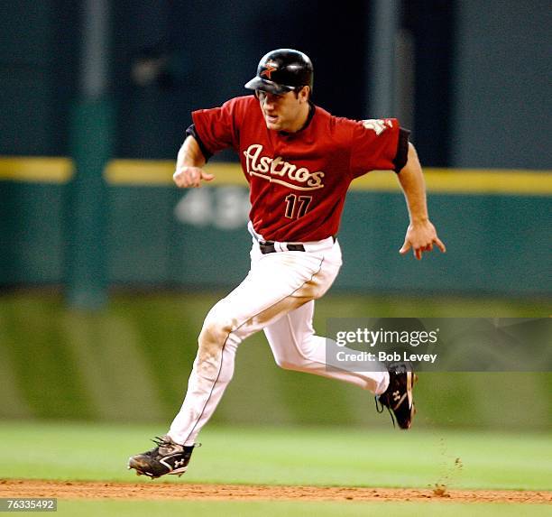 Lance Berkman of the Houston Astros heads to third on a double by Carlos Lee in the sixth inning against the Pittsburgh Pirates August 26, 2007 at...