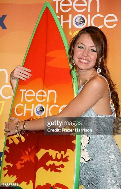 Actress Miley Cyrus poses in the press room during the 2007 Teen Choice Awards held at The Gibson Amphitheatre on August 26, 2007 in Universal City,...