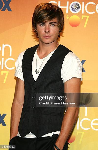 Actor Zac Efron poses in the press room during the 2007 Teen Choice Awards held at The Gibson Amphitheatre on August 26, 2007 in Universal City,...