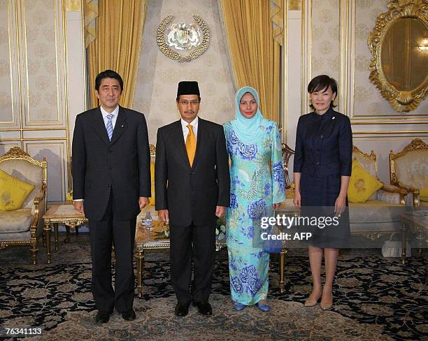 Japanese Prime Minister Shinzo Abe, King of Malaysia Sultan Mizan Zainal Abidin, Queen Nur Zahirah, and Japan's First Lady Akie Abe pose for a group...