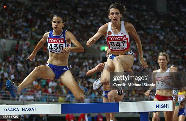 Sophie Duarte of France and race winner Yekaterina Volkova of Russia compete during the Women's 3,000m Steeplechase Final on day three of the 11th...