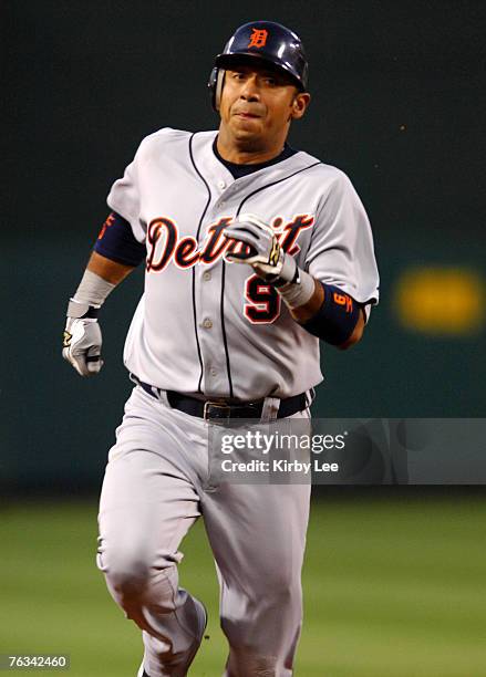 Carlos Guillen of the Detroit Tigers runs to third base during 9-5 victory over the Los Angeles Angels of Anaheim in Major League Baseball game at...