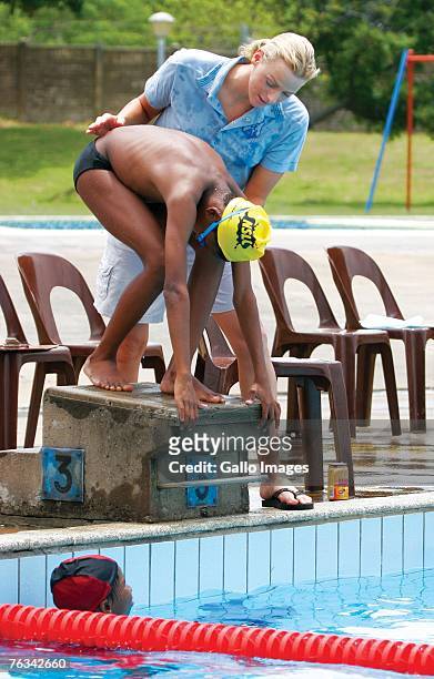 Swimmer Charlene Wittstock coaches children during a training session on December 2, 2006 in Richards Bay, South Africa.