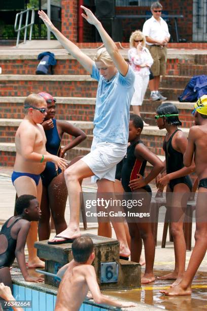 Swimmer Charlene Wittstock coaches children during a training session on December 2, 2006 in Richards Bay, South Africa.