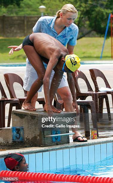 Swimmer Charlene Wittstock coaches children during a training session on December 2, 2006 in Richards Bay, South Africa.