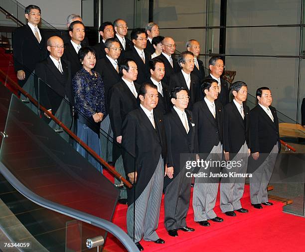 Japanese Prime Minister Shinzo Abe poses with his newly appointed cabinet members at the Prime Minister's official residence on August 27, 2007 in...