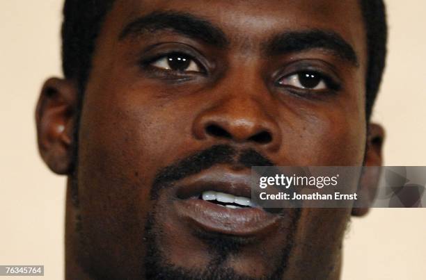 Atlanta Falcons quarterback Michael Vick speaks to reporters at the Omni Richmond Hotel after agreeing to a guilty plea on charges stemming from his...