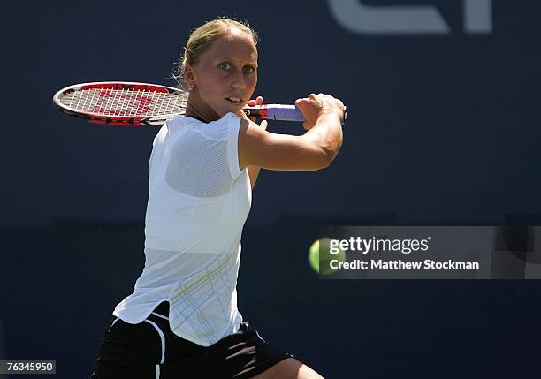 Julia Schruff of Germany hits a return against Ekaterina Makarova of Russia during day one of the U.S. Open at the Billie Jean King National Tennis...