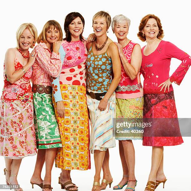 portrait of a group of mature women standing together and smiling - older women in short skirts stock pictures, royalty-free photos & images
