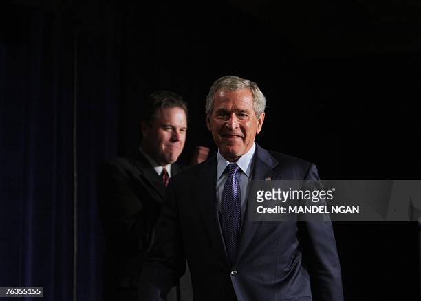 Washington State Republican Party Chairman Luke Esser applauds as US President George W. Bush arrives for a fundraiser for Representative Dave...
