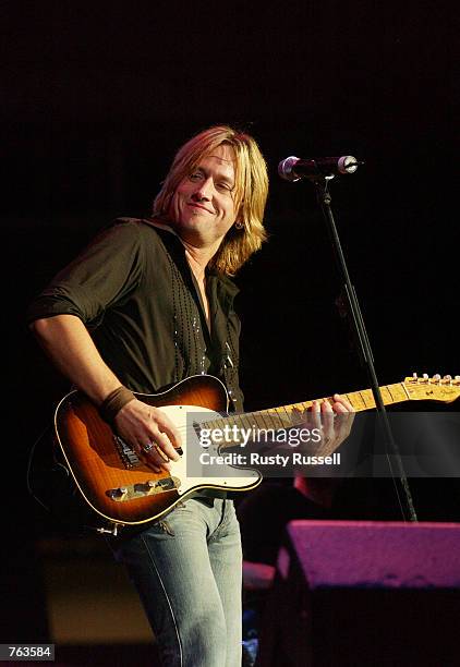 Singer Keith Urban performs at FanFair, the world's largest country music festival, June 15, 2002 in Nashville, Tennessee.