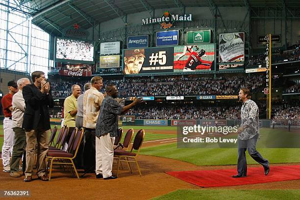 Former first baseman Jeff Bagwell of the Houston Astros is welcomed by former Houston Astros Jimmy Wynn, Larry Dierker, Nolan Ryan, Mike Scott and...