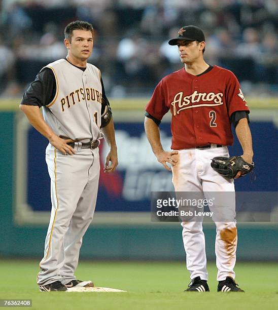 Freddy Sanchez of the Pittsburgh Pirates and Chris Burke of the Houston Astros talks during a pitching change in the MLB game on August 26, 2007 at...