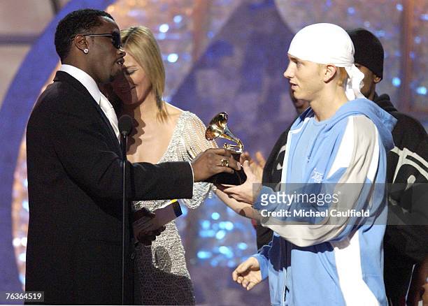 Sean "P. Diddy" Combs and Kim Cattrall present a GRAMMY award to Eminem for Best Rap Album