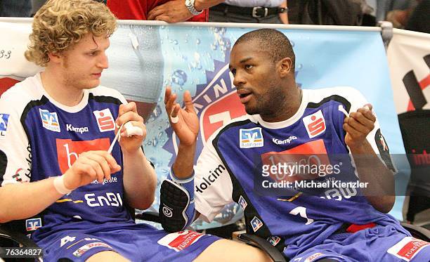 Felix Lobedank of Balingen-Weilstetten and Rock Feliho of BAlingen-Weilstetten discuss after the Handball Bundesliga match between...