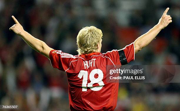 Liverpool's Dirk Kuyt celebrates scoring against Toulouse during their UEFA Champions League, third qualifying round, second leg football match at...