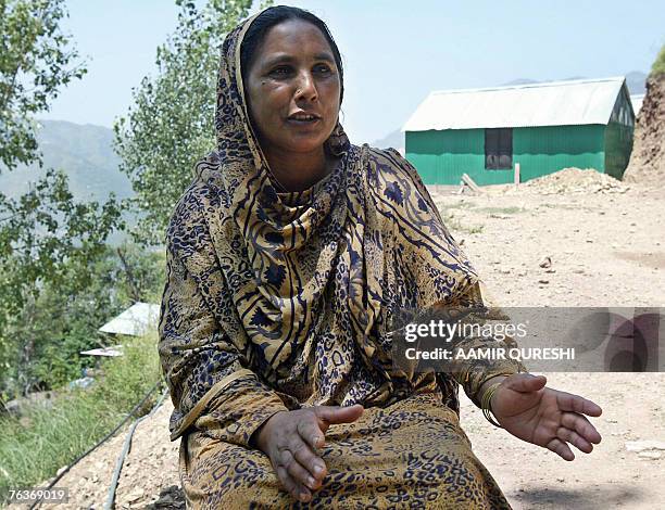 In this picture taken 16 August 2007, Pakistani Kashmiri woman Sajila Begum gestures as she speaks during an interview with AFP in front of a...