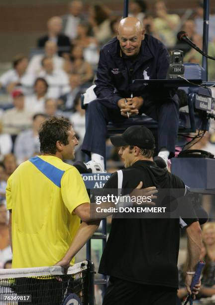 Justin Gimelstob of the US and compatriot number five seeded Andy Roddick discuss a call with the chair umpire during their match 28 August 2007 at...