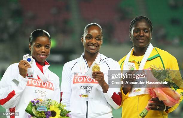 Silver medal winner Perdita Felicien of Canada, gold medal winner Michelle Perry of the United States of America and bronze medal winner Delloreen...