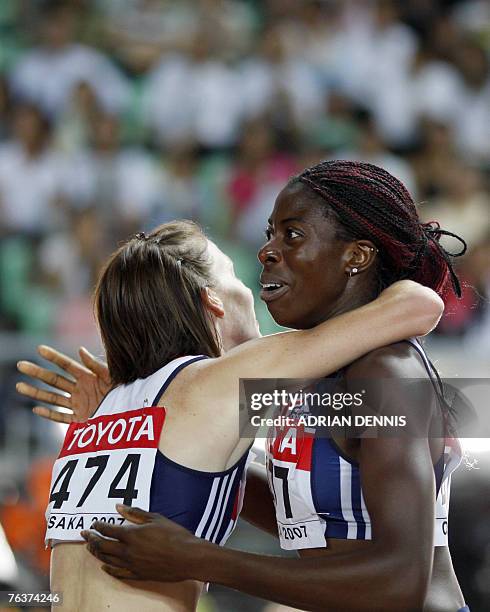 Britain's Christine Ohuruogu and Britain's Nicola Sanders celebrate after the women's 400m final, 29 August 2007, at the 11th IAAF World Athletics...