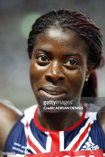 Britain's Christine Ohuruogu celebrates after the women's 400m final, 29 August 2007, at the 11th IAAF World Athletics Championships, in Osaka....