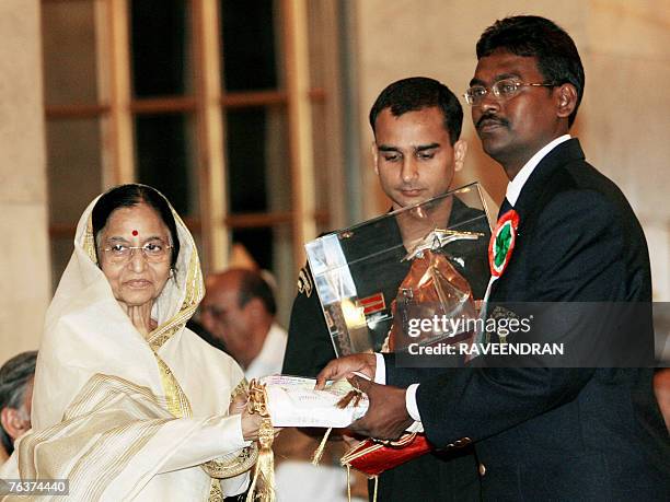 Indian water adventurer Tapas Chowdhury receives The Tenzing Norgay National Adventure Awards 2006 from Indian President Pratiba Patil during a...