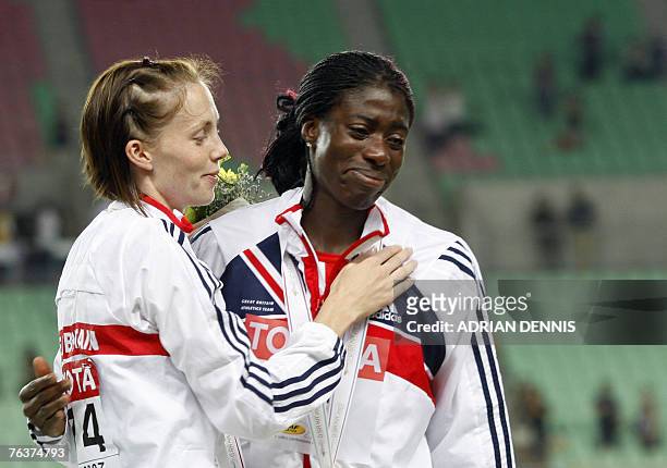 Britain's Christine Ohuruogu and Britain's Nicola Sanders pose during the medal ceremony after the women's 400m final, 29 August 2007, at the 11th...