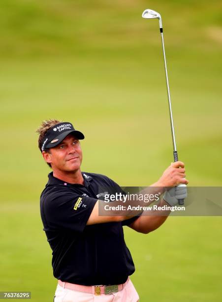 Darren Clarke of Northern Ireland hits his second shot on the 13th hole during the Pro Am prior to the start of The Johnnie Walker Championship on...