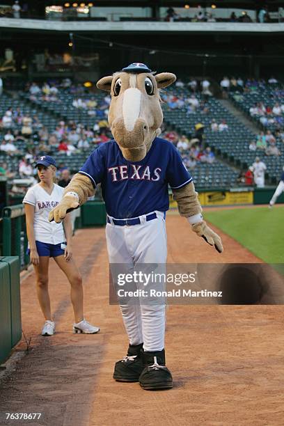 The Texas Rangers mascot "Rangers Captain" entertains before the start of the MLB game between the Chicago White Sox and the Texas Rangers on August...