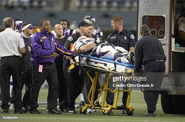 Linebacker Cameron Siskowic of the Minnesota Vikings is loaded into an ambulance after being injured in the fourth quarter of a preseason game...