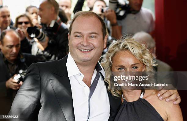 Anchor Sebastien Cauet and his co-presenter Cecile de Menibus arrive at the TF1 annual press conference held at the Olympia on August 29, 2007 in...