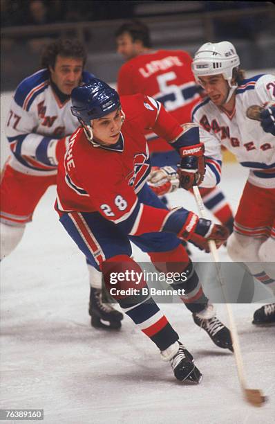 Canadian ice hockey player Pierre Larouche of the Montreal Canadiens evades his opponants during a game against the New York Rangers at Madison...