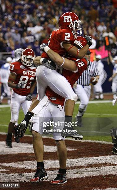Rutgers wide receiver Tim Brown jumps into the arms of Rutgers tight end Anthony Cali after scoring in the first period. The Scarlet Knights beat the...