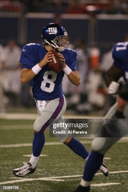 Quarterback Tim Hasselbeck of the New York Giants drops back to pass against the New York Jets during the preseason game on August 25, 2007 at Giants...