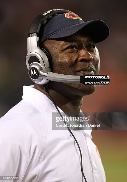 Head coach Lovie Smith of the Chicago Bears watches from the sidelines as his team takes on the Cleveland Browns in a preseason game at Soldier Field...
