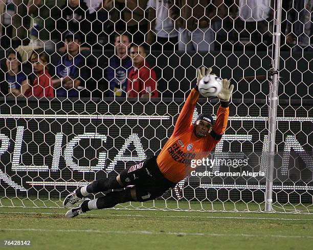 Pachuca's goal keeper Miguel Calero makes a save on a Los Angeles Galaxy's shot from the penalty spot during the Superliga Final game between CF...