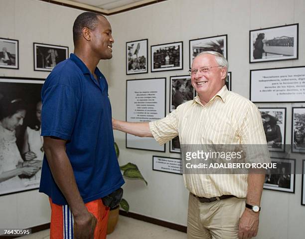 Oskar Lafontaine , co-chairman of Germany's The Left political party, greets former Olimpic champion boxer Cuban Felix Savon 30 August 2007 in a...