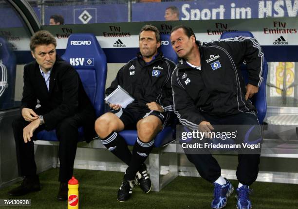 Manager Dietmar Beiersdorfer, second Coach Markus Schupp and Coach Huub Stevens of Hamburg looks on during the UEFA Cup second qualifying round...