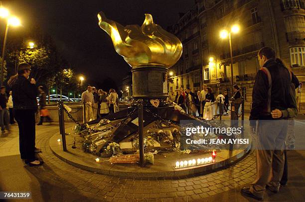 Handful of Diana fans gather early 31 August 2007 at the Paris site where the princess's car crashed 10 years ago, almost hour for hour. The Alma...