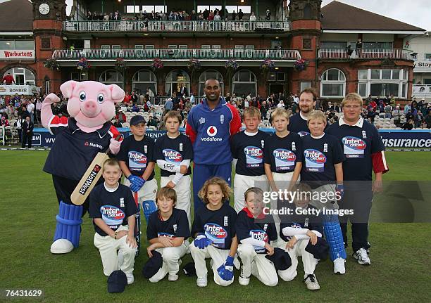 Lytham CC pose with Dimitri Mascarenhas of England during the Fourth NatWest Series One Day International Match between England and India at Old...