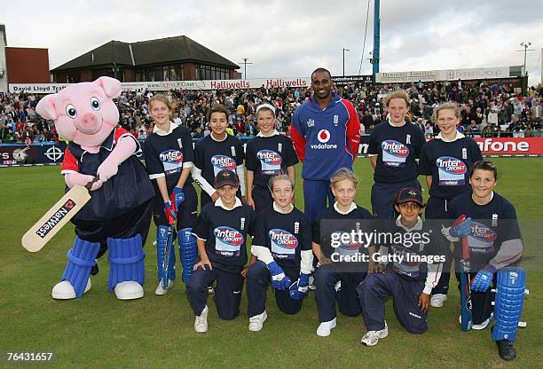 Lancs County Girls U13s pose with Dimitri Mascarenhas of England during the Fourth NatWest Series One Day International Match between England and...